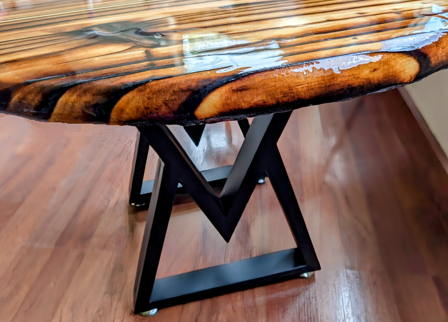 Handcrafted Shou Sugi Ban coffee table with deep-burned wood and epoxy resin — perfect for man caves, game rooms, and entertainment spaces